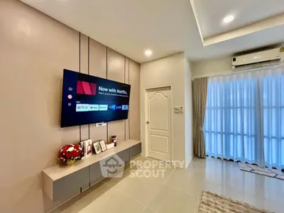 Modern living room with wall-mounted TV and elegant decor