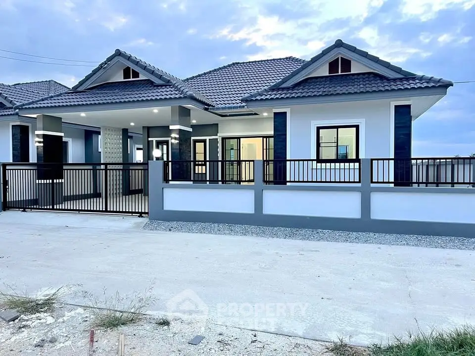 Charming modern house with tiled roof and spacious driveway, perfect for family living.