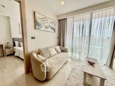 Modern living room with cozy sofa and large window offering city view, adjacent to stylish bedroom.