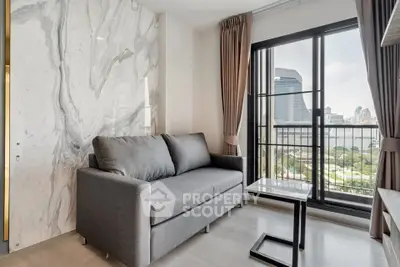 Modern living room with marble accent wall and city view balcony.