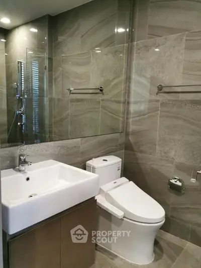 Modern bathroom with sleek fixtures and elegant tile design