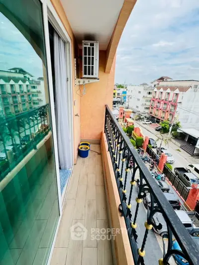 Charming balcony with city view, perfect for relaxation and enjoying the urban landscape.