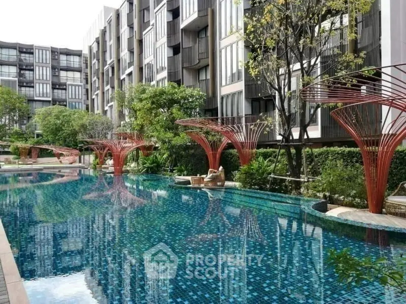 Luxurious condominium with stunning pool and modern architecture