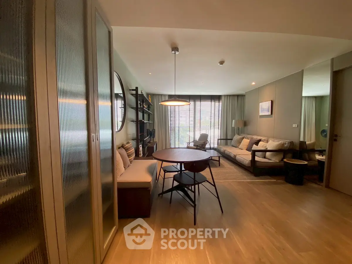 Stylish modern living room with wooden flooring and cozy seating area