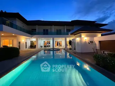 Luxurious modern villa with stunning pool and evening ambiance