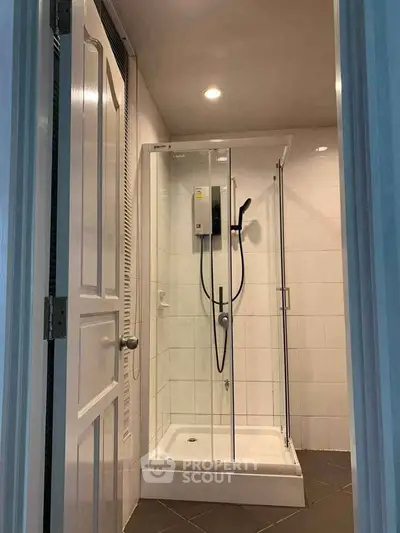 Modern bathroom with glass shower enclosure and sleek design