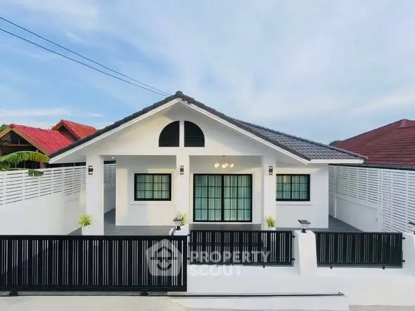 Charming single-story house with modern design and spacious front yard in a serene neighborhood.