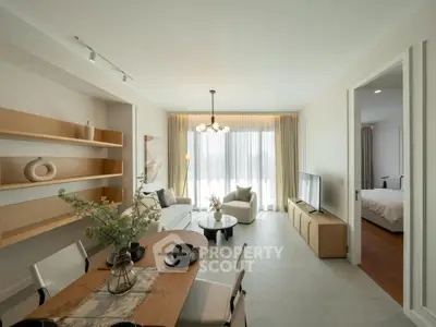 Modern open-plan living room with dining area and natural light