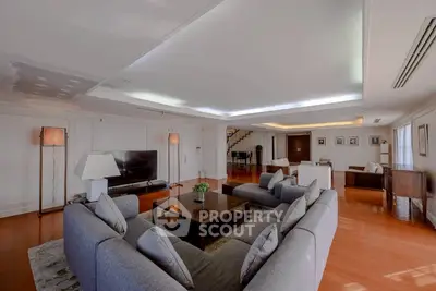 Spacious modern living room with elegant decor and ample natural light