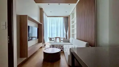 Modern living room with sleek design, large windows, and stylish furniture in a contemporary apartment.