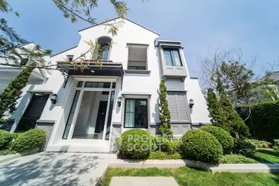 Stunning modern house exterior with lush garden and elegant architecture.