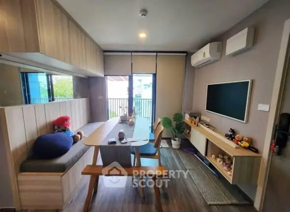 Modern living room with stylish decor and balcony view