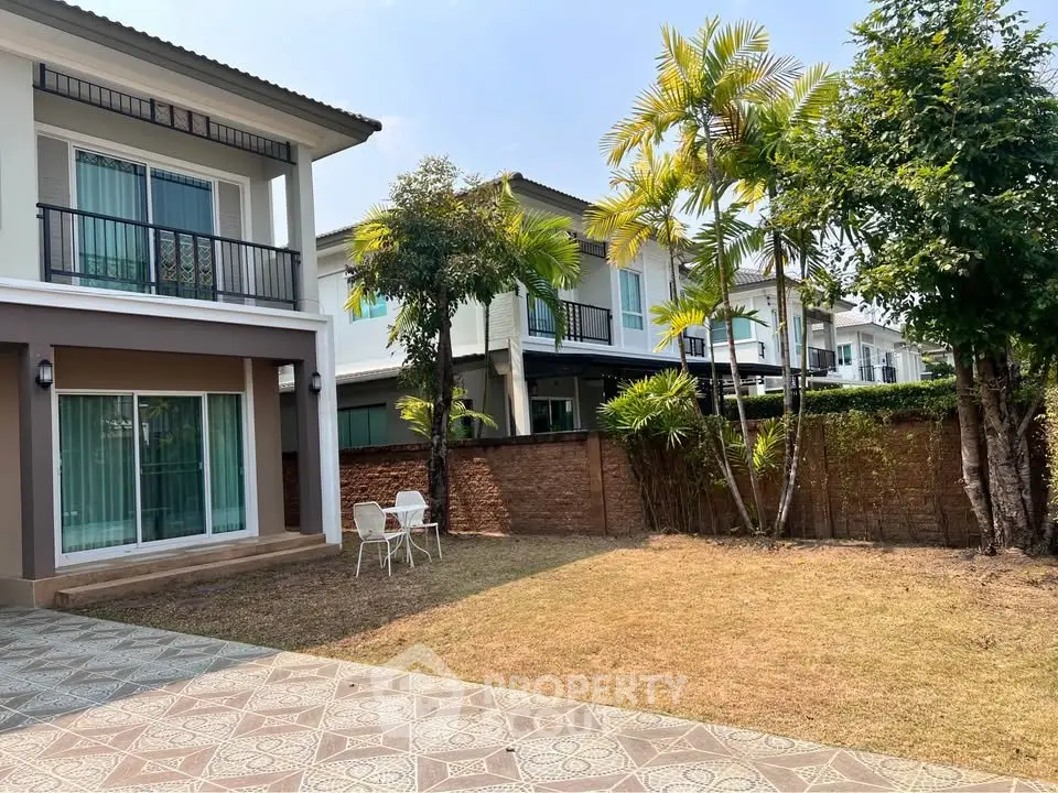 Charming suburban home with spacious backyard and patio, perfect for outdoor relaxation and family gatherings.