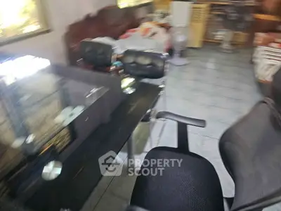Spacious home office with modern furniture and ample natural light.