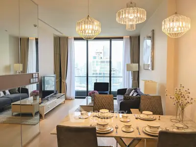 Luxurious modern living room with elegant dining area and stunning city view