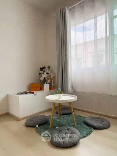Cozy minimalist living room with natural light and modern decor