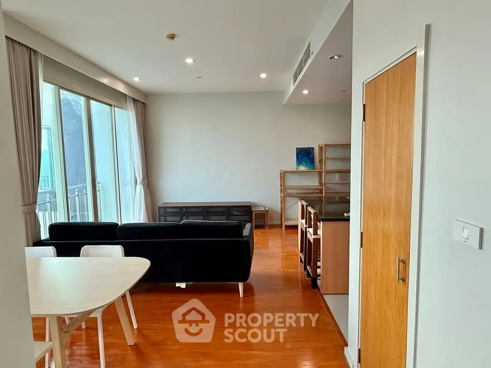 Spacious living room with modern furniture and large windows for natural light.