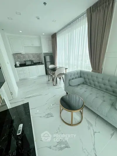 Elegant modern living room with marble flooring and stylish furniture in a bright apartment.