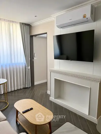 Modern living room with sleek TV setup and elegant decor