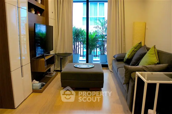 Modern living room with stylish decor and balcony view