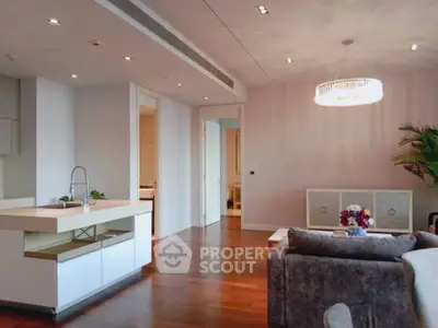 Luxurious open-plan living room with modern kitchen and elegant decor