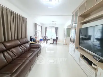 Spacious living room with modern decor and large windows for natural light.
