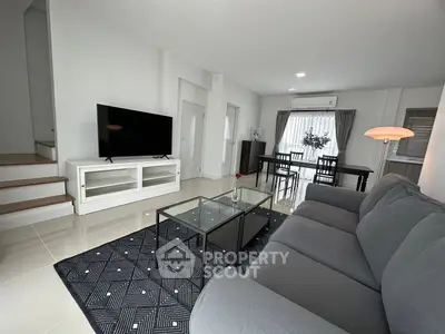 Spacious modern living room with sleek furniture and natural light