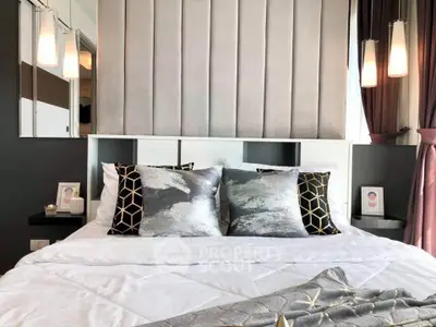 Luxurious modern bedroom with stylish decor and plush bedding in a contemporary apartment.