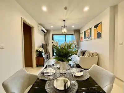 Modern living room with elegant dining area and large window view