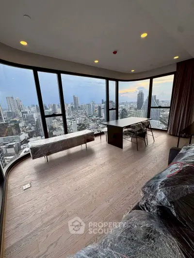 Stunning high-rise corner unit with panoramic city views and modern furnishings.