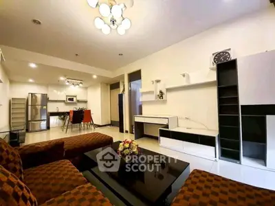 Spacious modern living room with open kitchen and stylish furniture