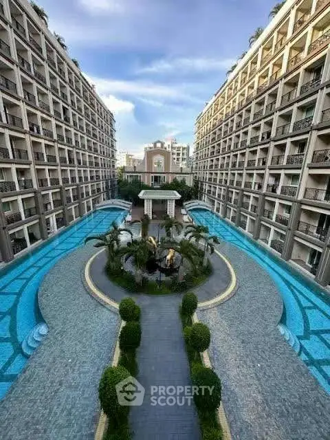 Luxurious apartment complex with stunning courtyard and pool view.