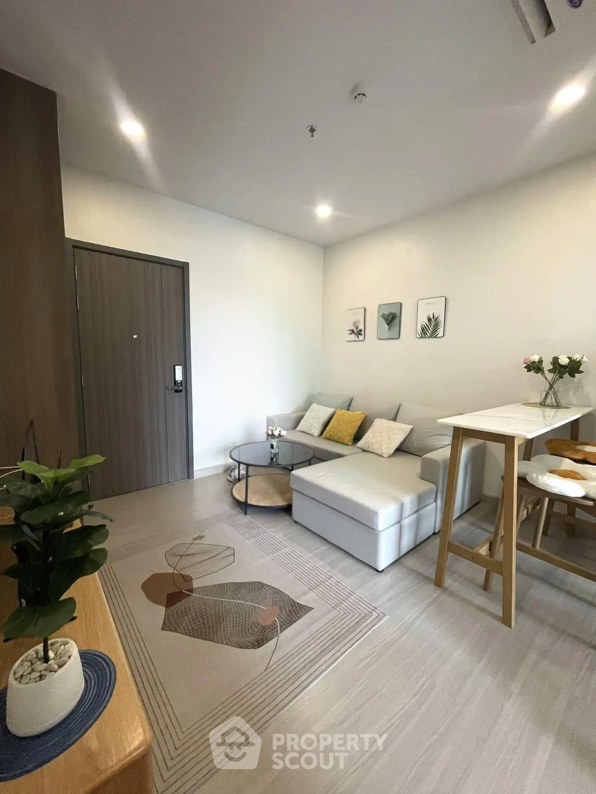 Modern living room with stylish decor and cozy seating area in a contemporary apartment.