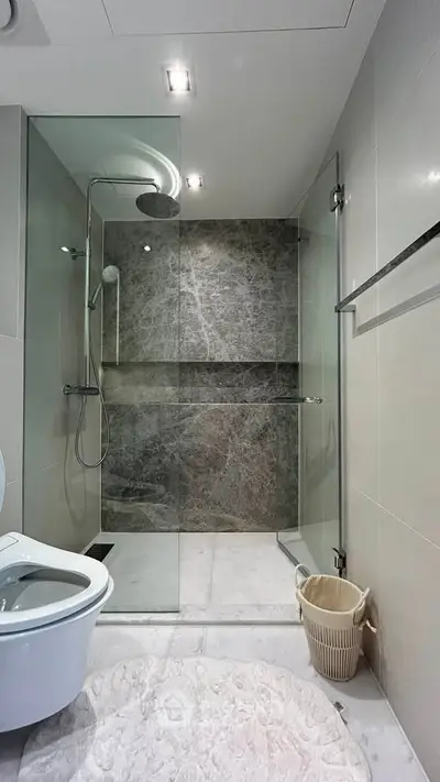 Modern bathroom with glass shower enclosure and sleek design
