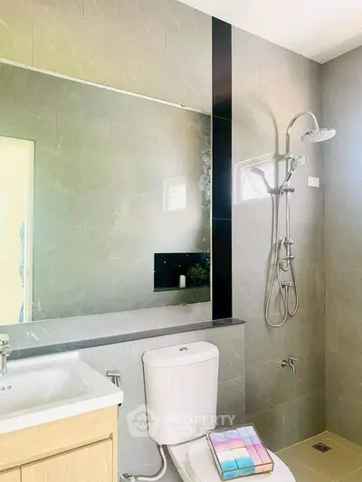 Modern bathroom with sleek shower and large mirror