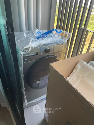 Modern apartment balcony with new washing machine installation