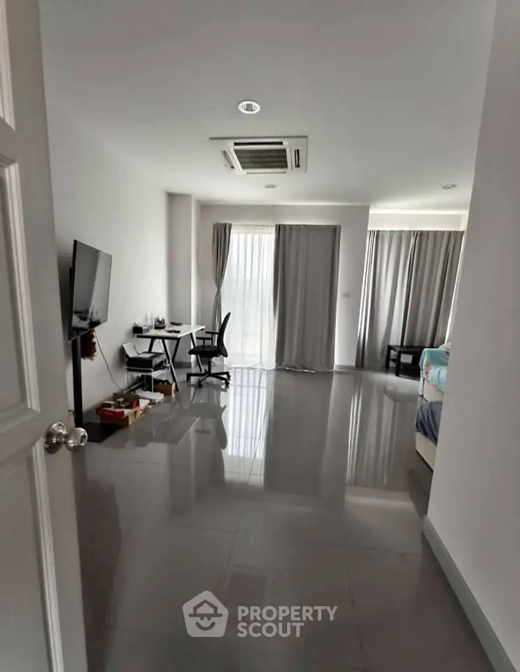 Spacious modern apartment with sleek flooring and natural light