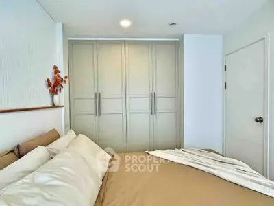 Cozy bedroom with modern wardrobe and stylish decor