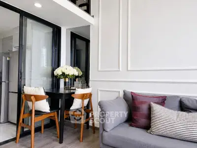 Modern living room with elegant dining area and stylish decor