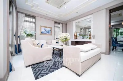Luxurious living room with elegant decor and plush seating in a modern home.