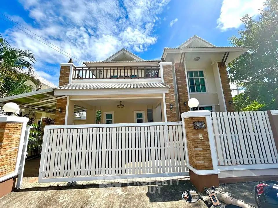 Charming two-story house with spacious balcony and modern design in a serene neighborhood.