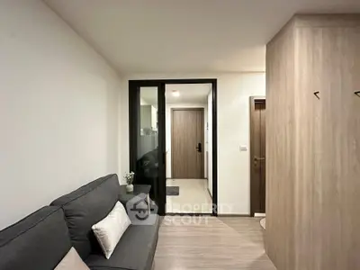 Modern apartment entrance with cozy living area and stylish decor