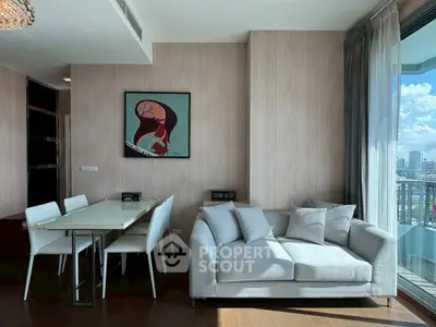 Modern living room with elegant dining area and city view balcony