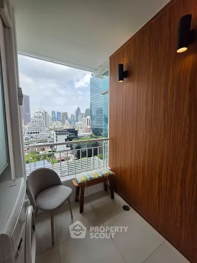 Chic balcony with stunning city view, perfect for relaxation and enjoying urban skyline.