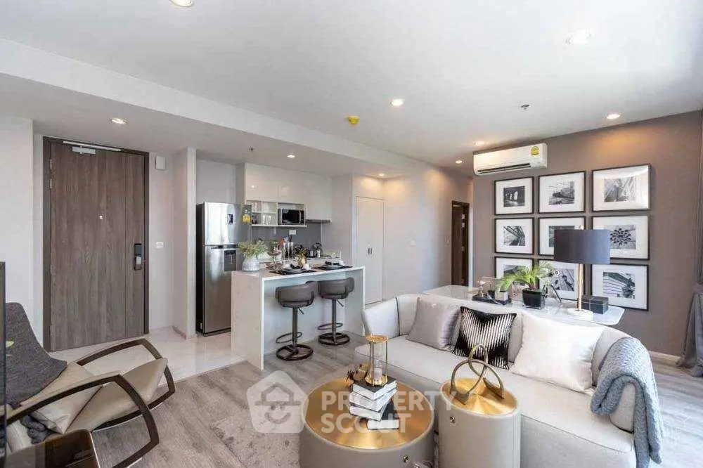 Modern open-plan living room with stylish kitchen and cozy seating area