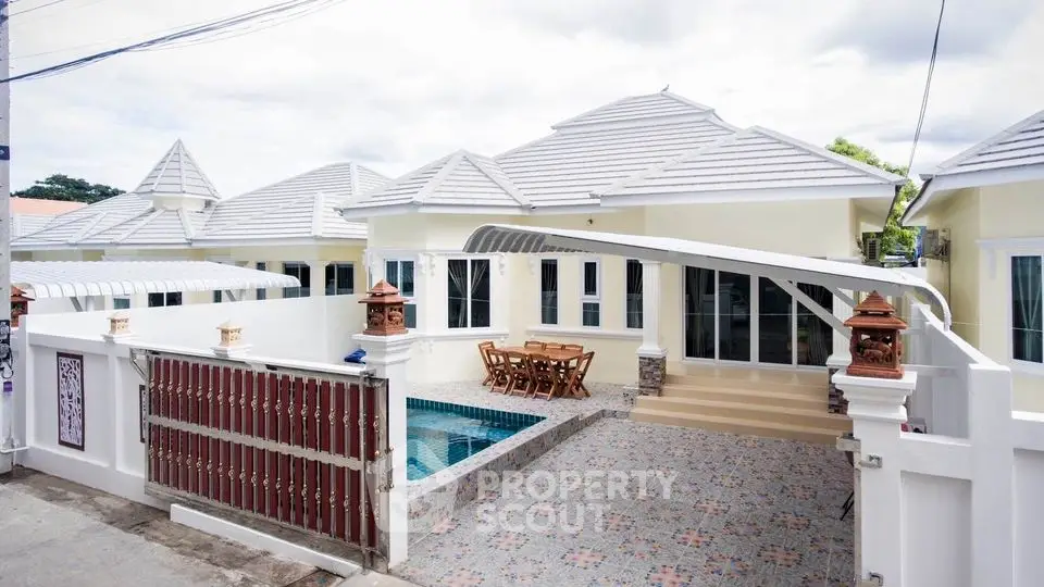 Charming single-story home with pool and spacious patio, perfect for outdoor entertaining.
