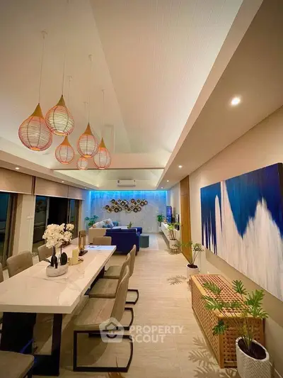 Luxurious modern living room with elegant dining area and stylish lighting fixtures.