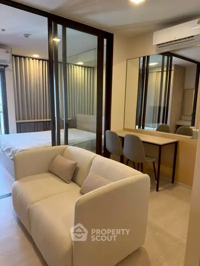 Modern studio apartment with cozy living area and stylish decor