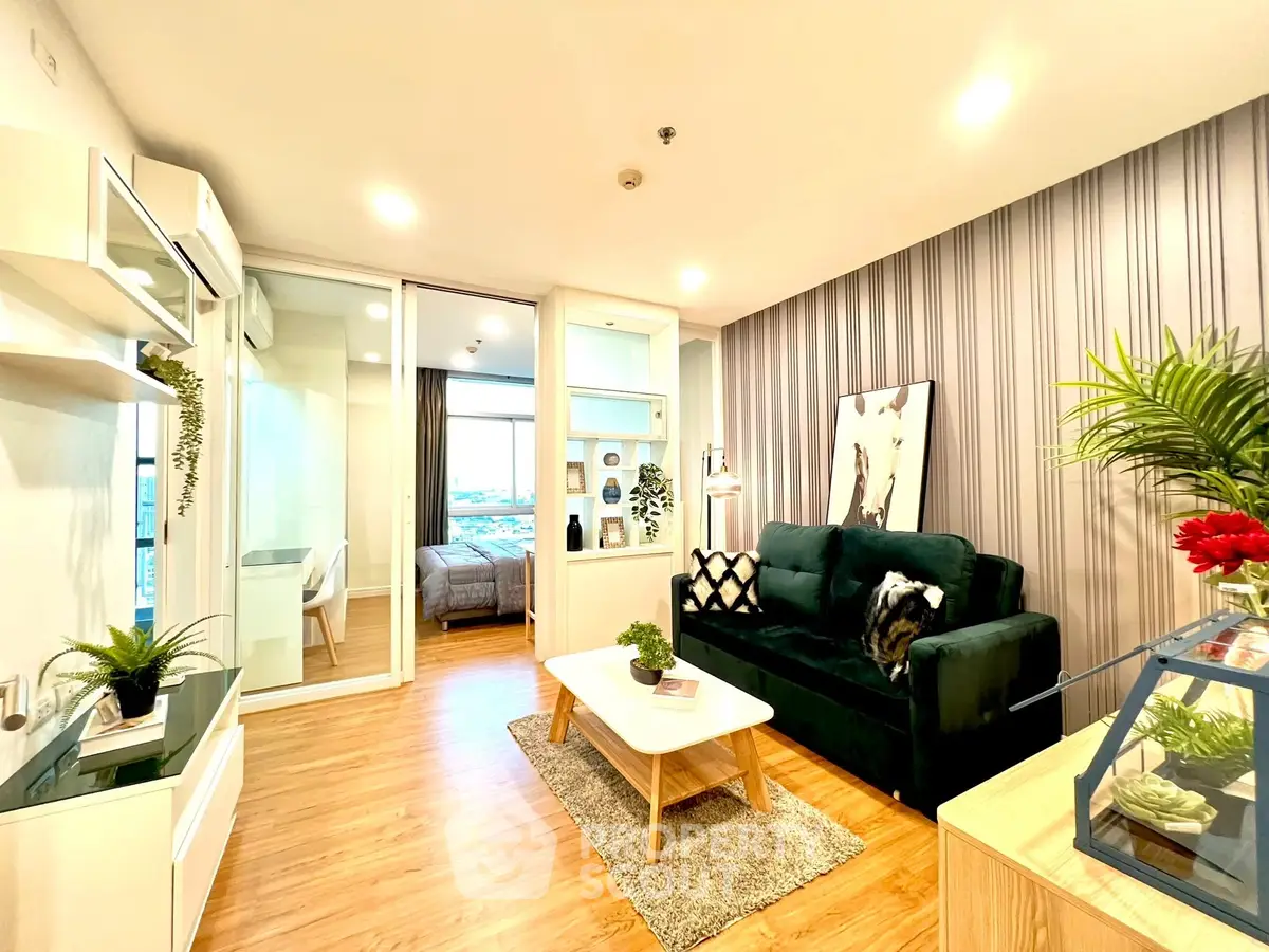 Modern living room with stylish decor and open layout, featuring a cozy sofa and elegant wooden flooring.