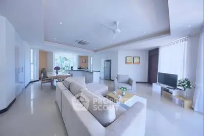 Spacious modern living room with open kitchen and elegant decor